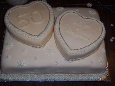 This golden wedding anniversary cake was 2 layers of golden lemon and filled 